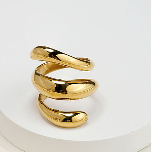 Anillo espiral de acero con baño oro 18k