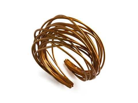 Brazalete garabato oro oscuro en material sintético)