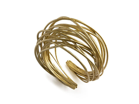 Brazalete garabato oro claro en material sintético